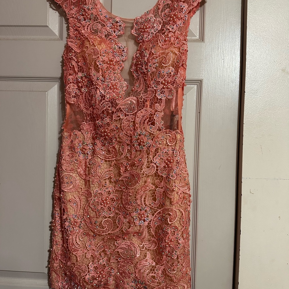 Formal or special occasion dress. Beaded and studded crochet fabric lace.